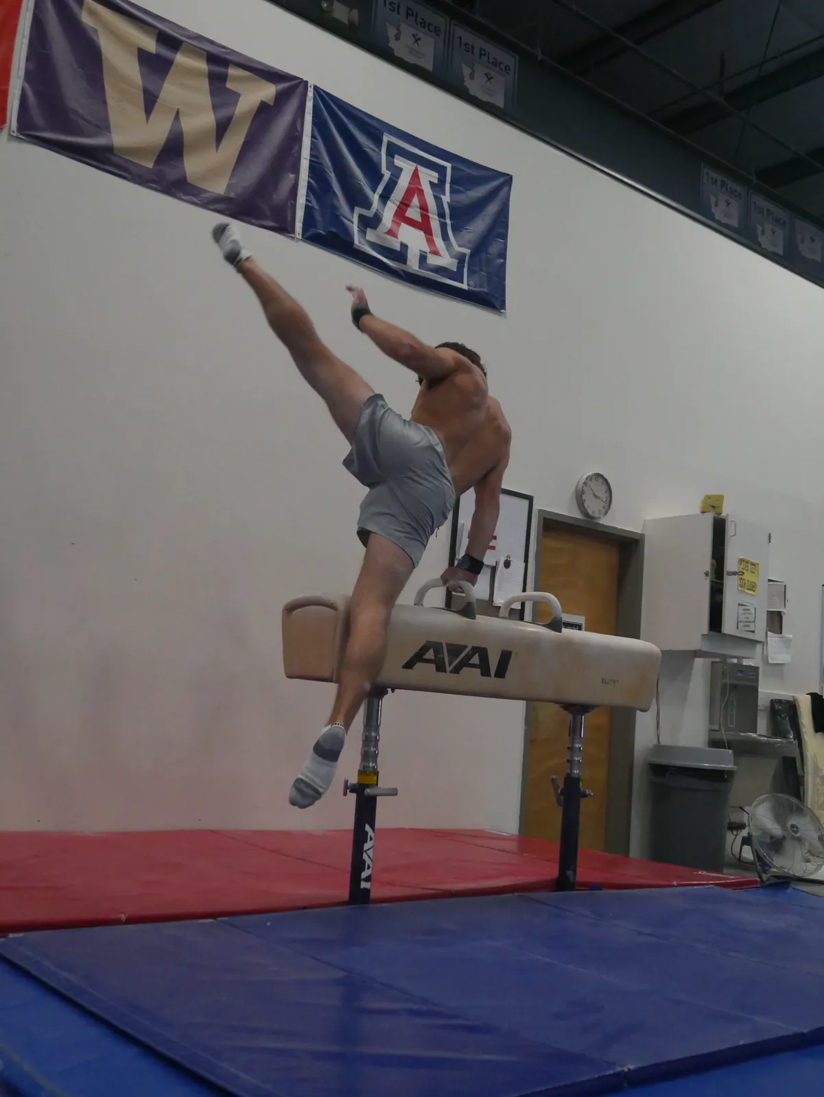 Gymnast performing above the competition floor