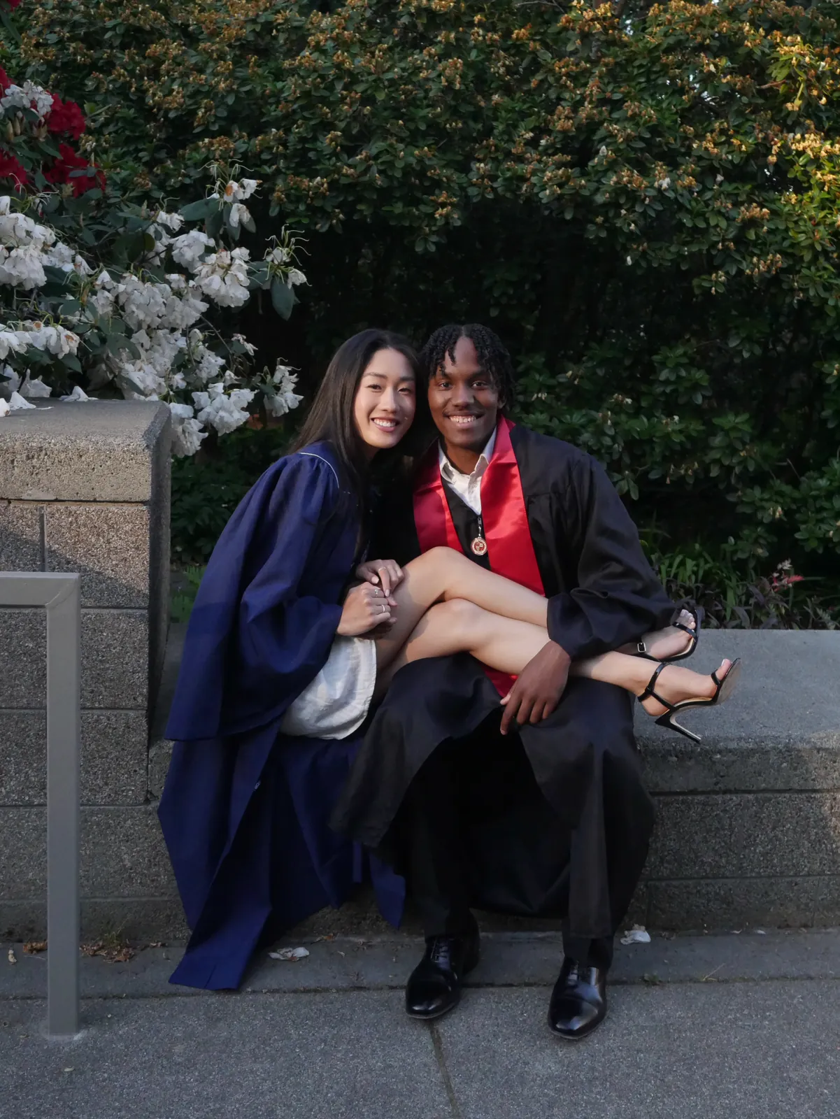 Graduates posing together outdoors