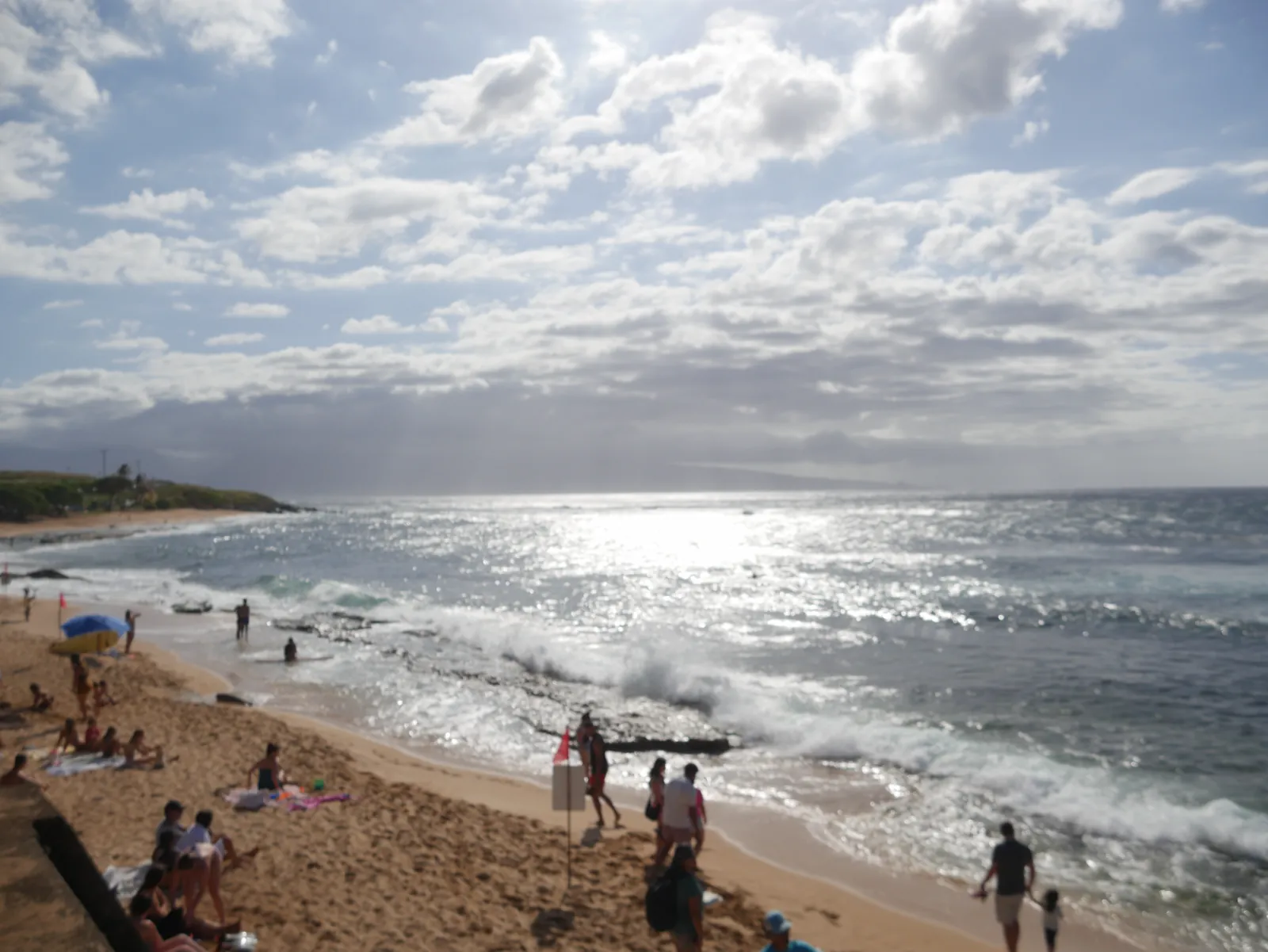 Sunlight reflecting across the ocean shoreline